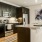 a kitchen with black cabinets
