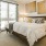 a bedroom with a bed and a fan