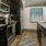 a kitchen with black appliances