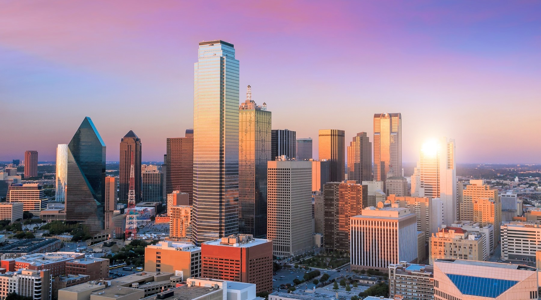 Love where you live a city skyline with the sun in the background