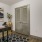 a room with a table and a painting on the wall
