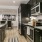 a kitchen with black cabinets