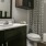 a bathroom with a sink toilet and mirror