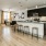 a kitchen with a bar stools