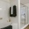 a bathroom with a bathtub and a shower unit